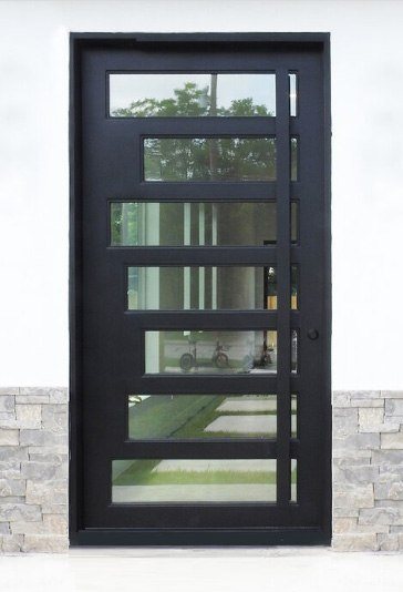 Iron door with seven windows of varying sizes