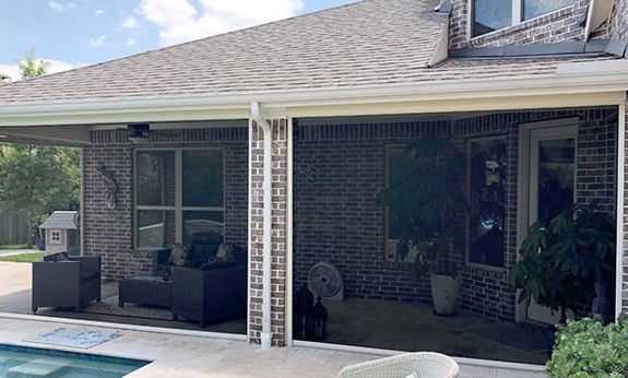 Patio enclosed by motorized shade system