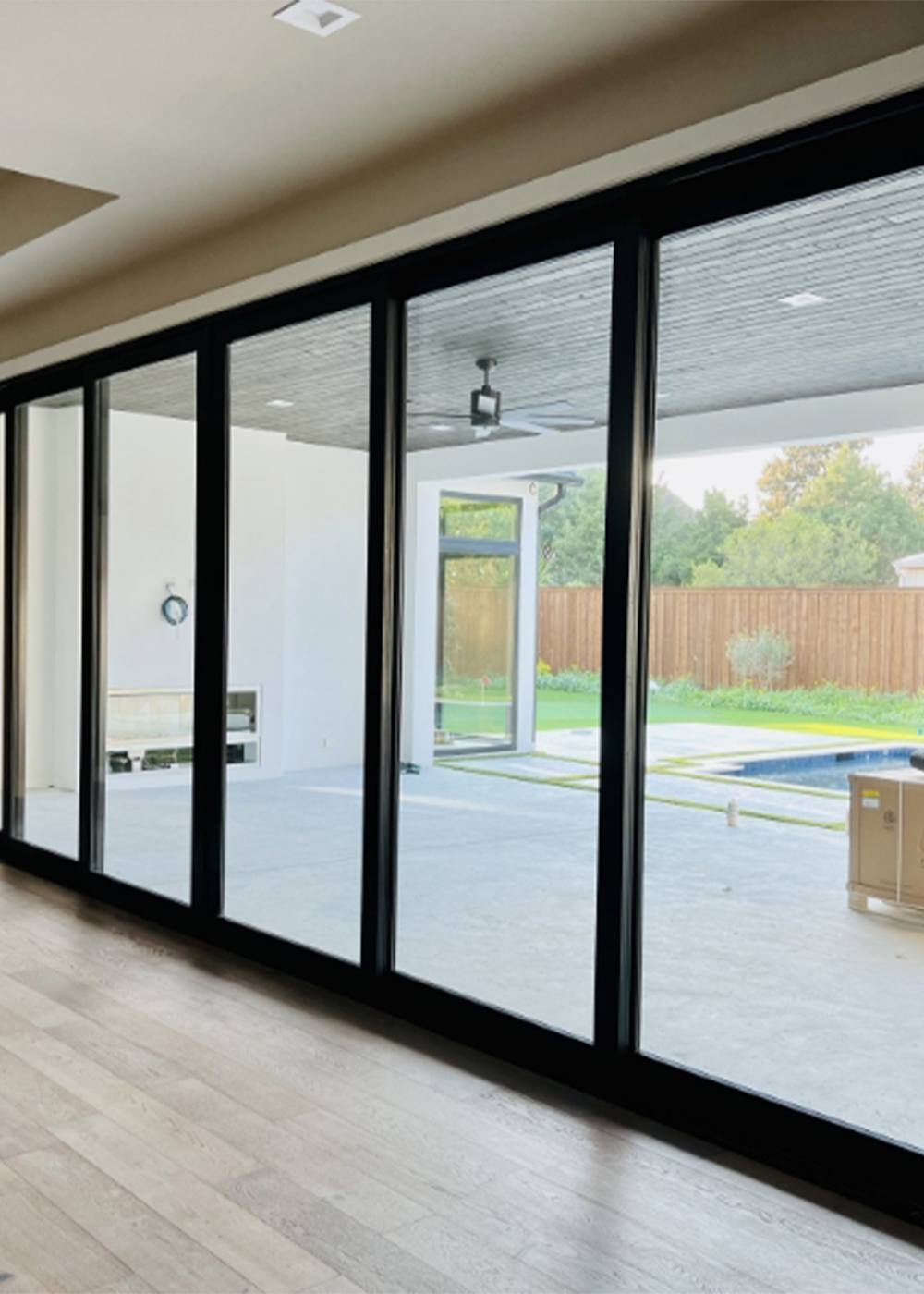 Custom iron framed sliding glass doors and window panels