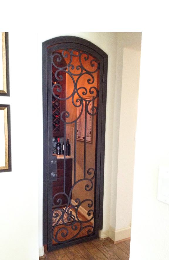 Single eyebrow top iron gate into wine cellar