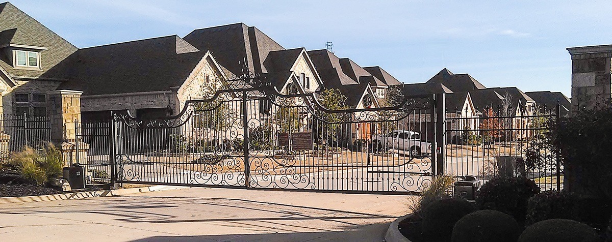 Intricate design iron driveway gate