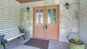 a closeup of a wooden double entry door 