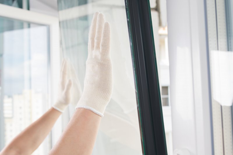 person installing a replacement window